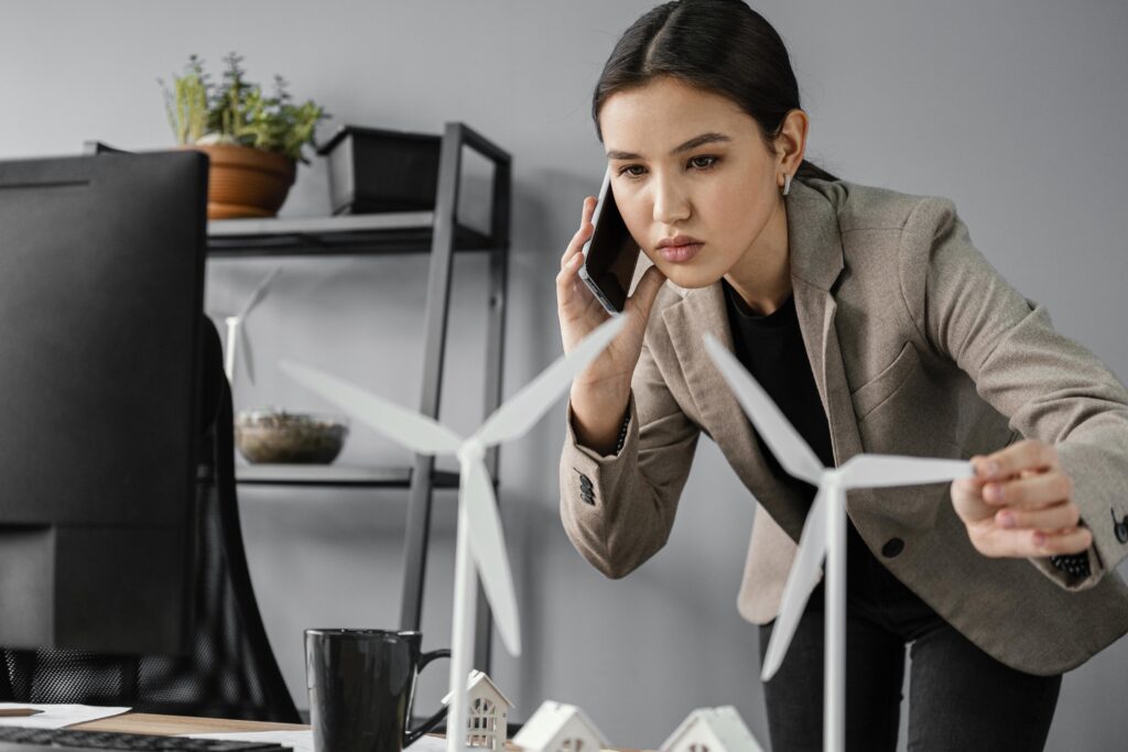 Professional woman models for renewable energy cold calling and project analysis.
